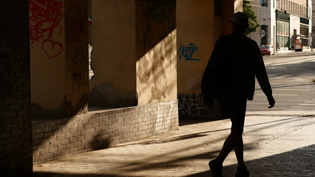mysterious man walking street