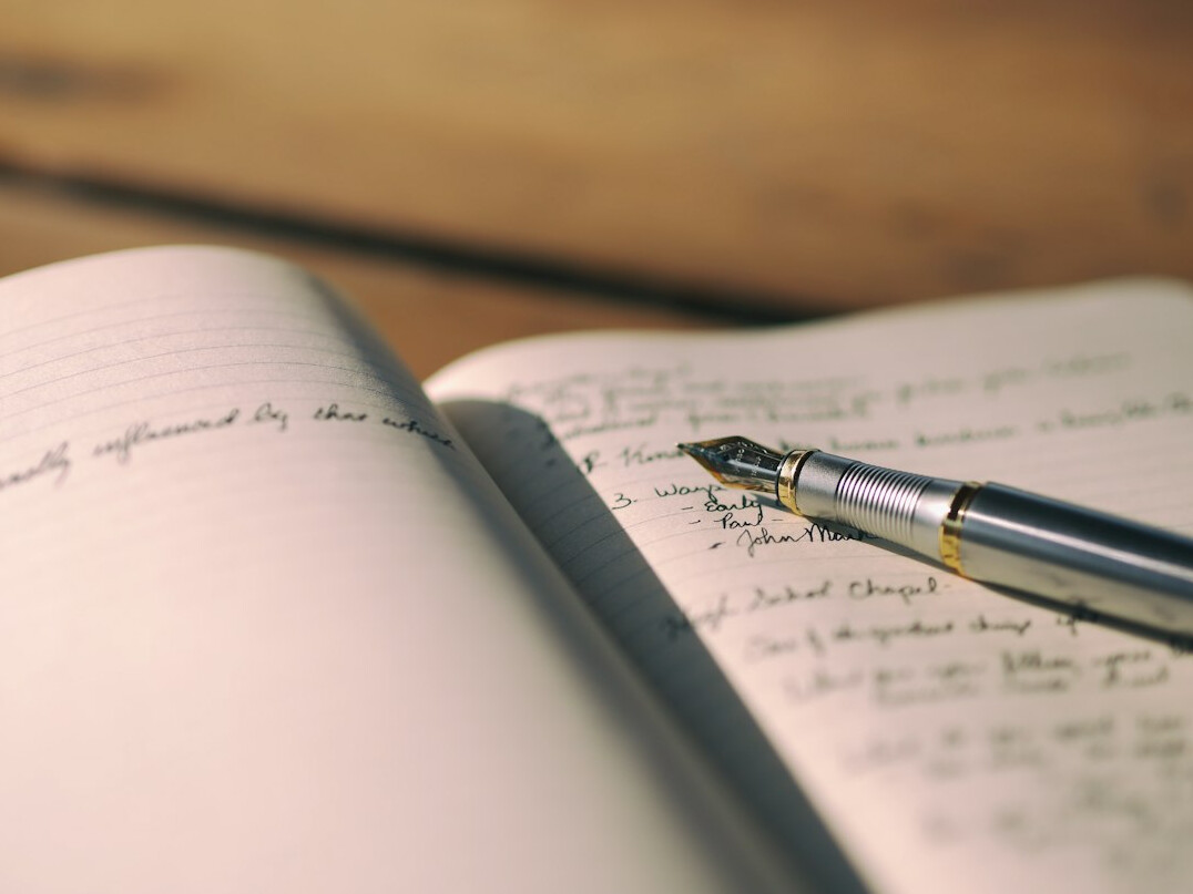 writer notebook with pen
